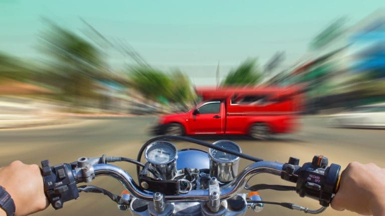 motorcycle about to hit a truck