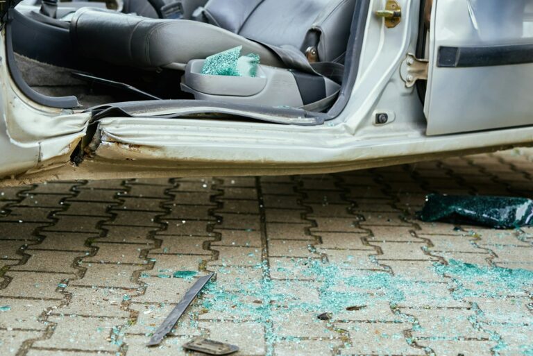Crashed car after traffic accident on road