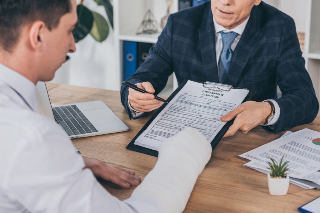 a man holding a pen and looking at a document
