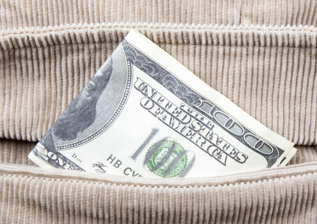 a folded paper money in a pocket