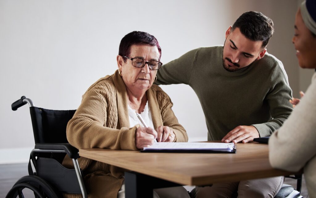 a man helping an old woman