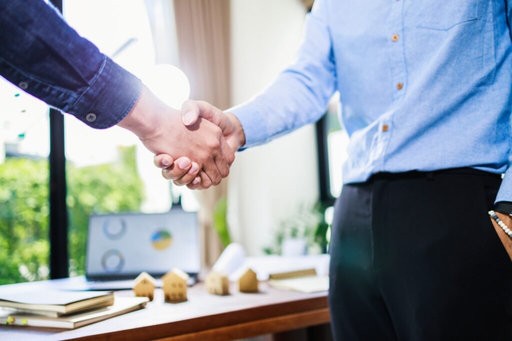 a close-up of a man shaking hands