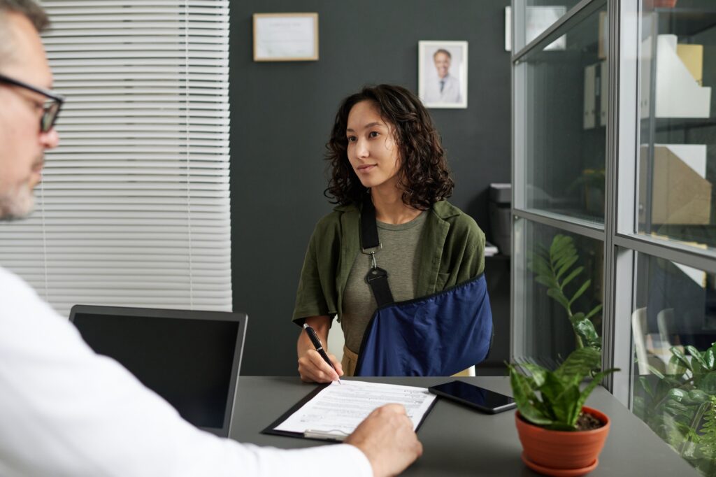 a woman signing a document