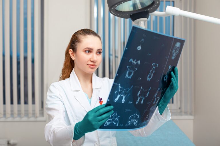 Female doctor looking at x-ray, head MRI scan, analysis of injury of soft brain takanas