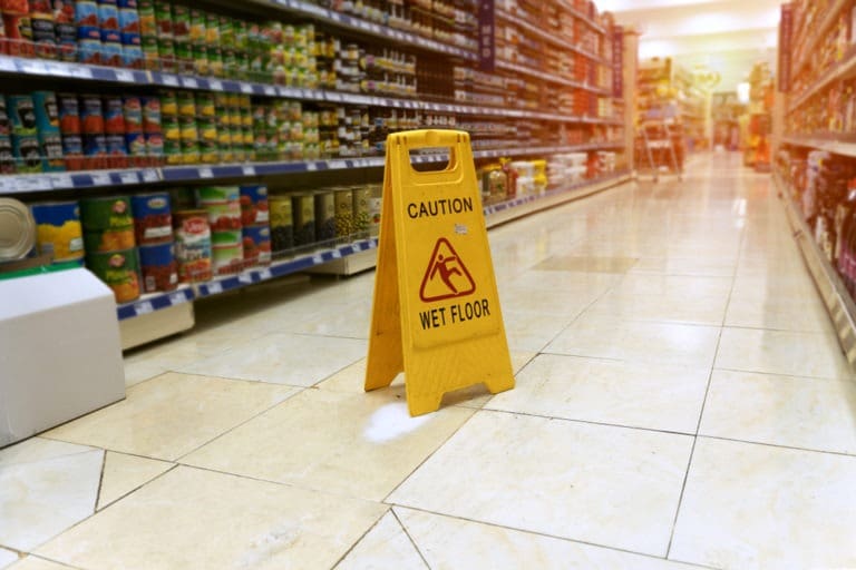 caution sign in store aisle