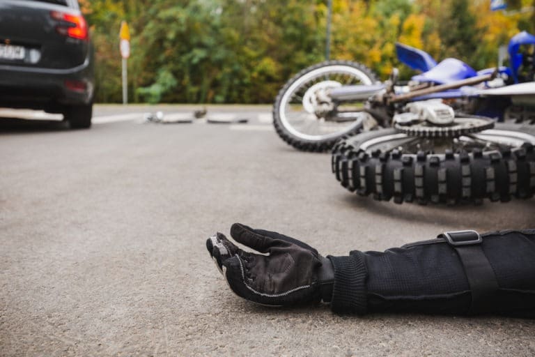 motorcyclist lying in the road