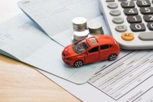 toy car with coins and paperwork