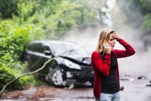 woman calling for help after an accident