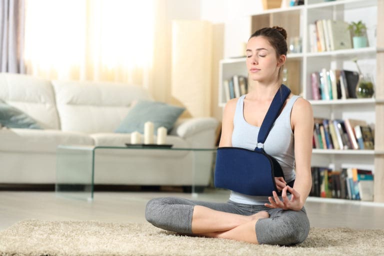 woman doing yoga in a sling