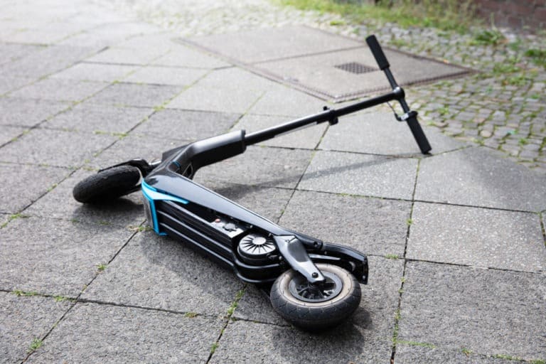 electric scooter lying on the ground