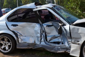 silver car smashed in a side-impact accident