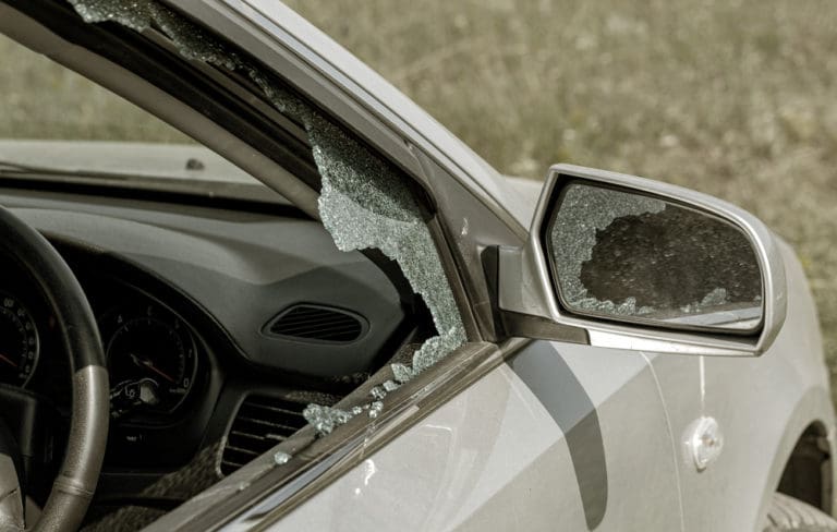 car with busted window after side-impact accident