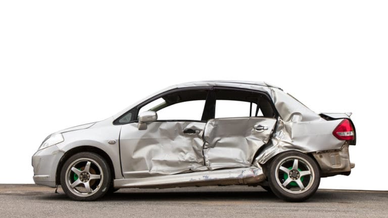 crushed silver car