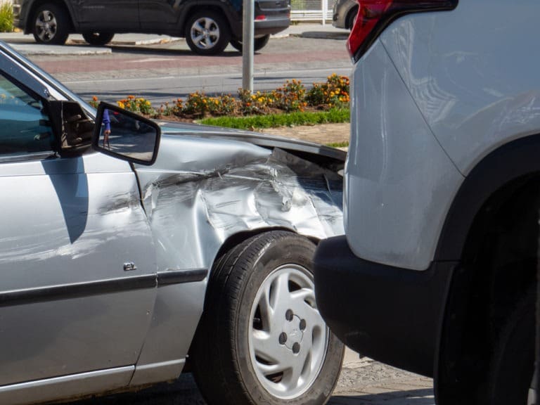 side-impact collision damages to a silver car