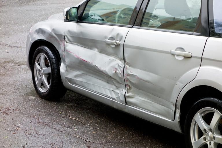 damaged silver car