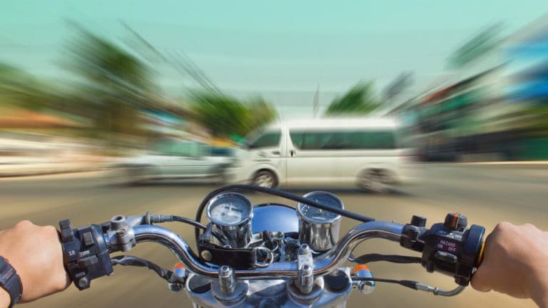 motorcycle speeding toward traffic