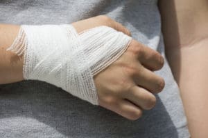 person with a bandaged hand