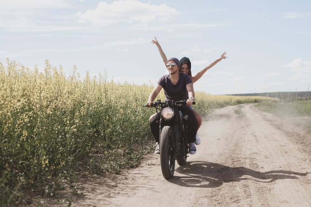 happy couple on a motorcycle