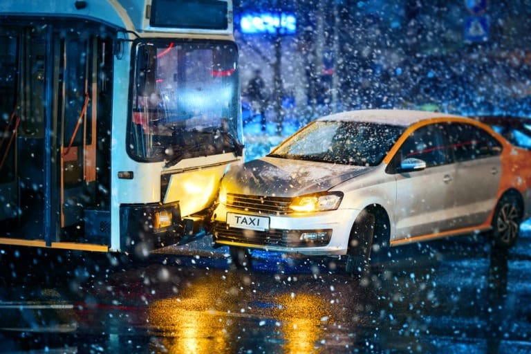 a-bus-and-a-taxi-after-a-collision-in-the-snow