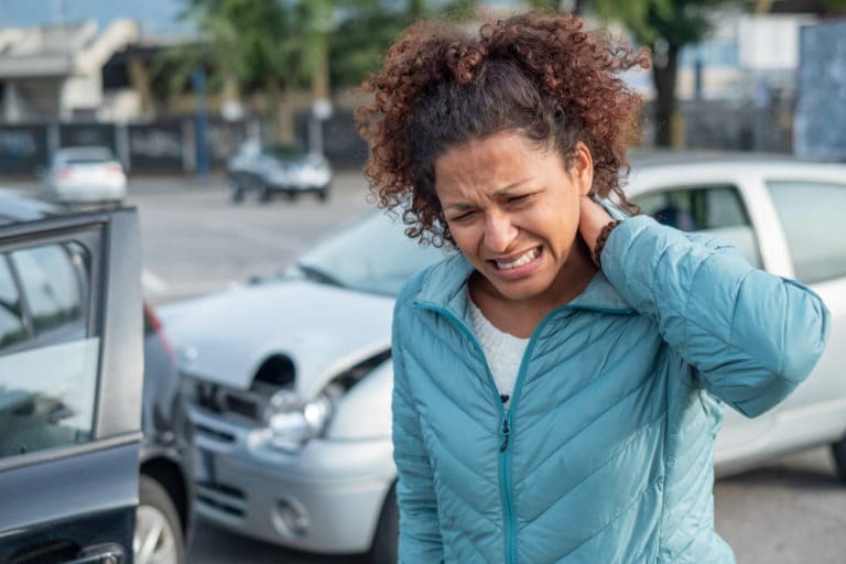 woman-with-whiplash-holding-neck-in-pain-after-car-accident