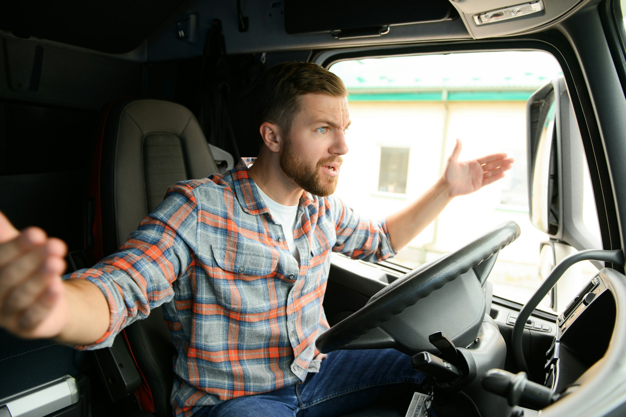 Angry truck driver shouting in his vehicle