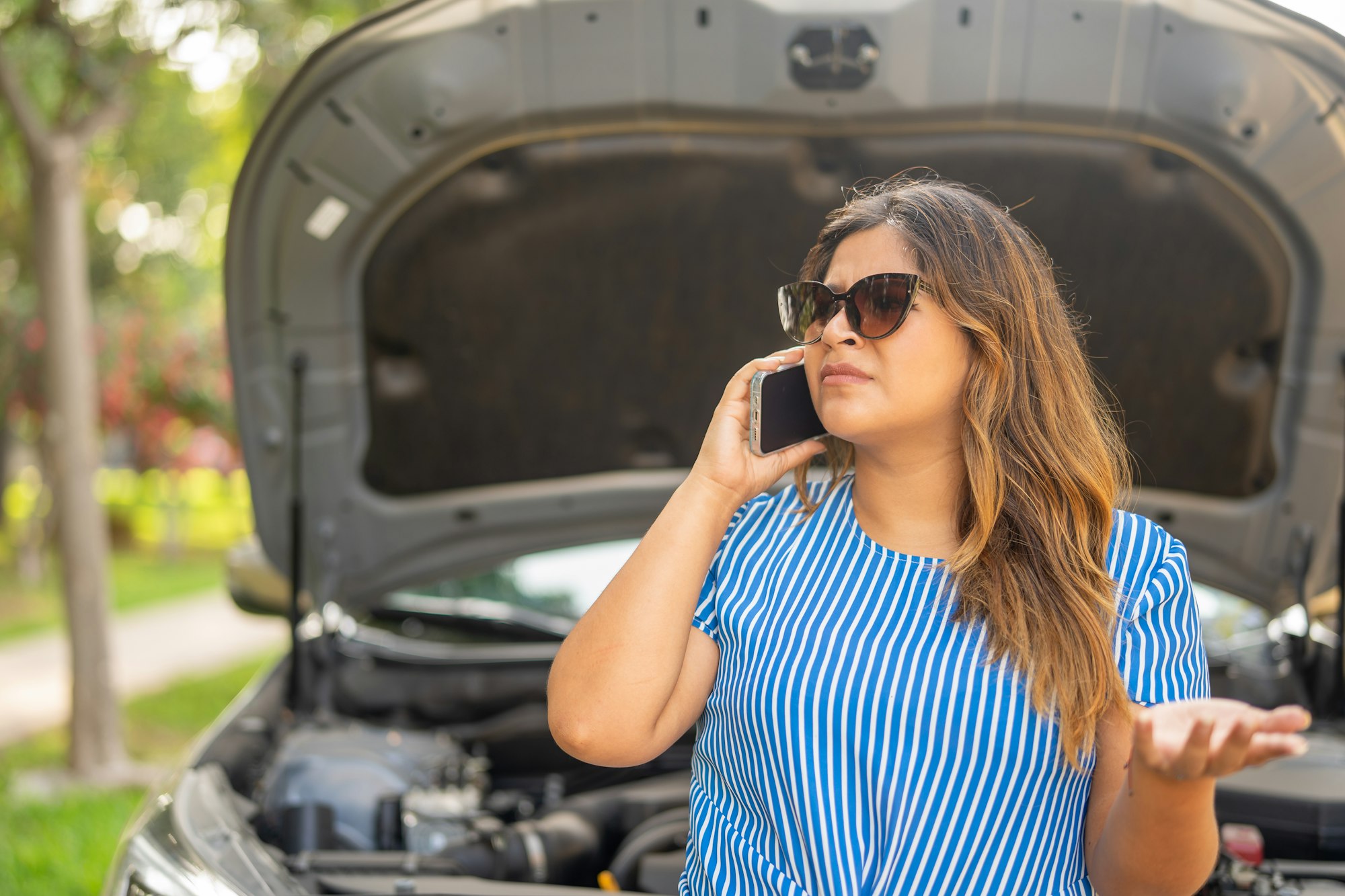 Woman calling tow truck