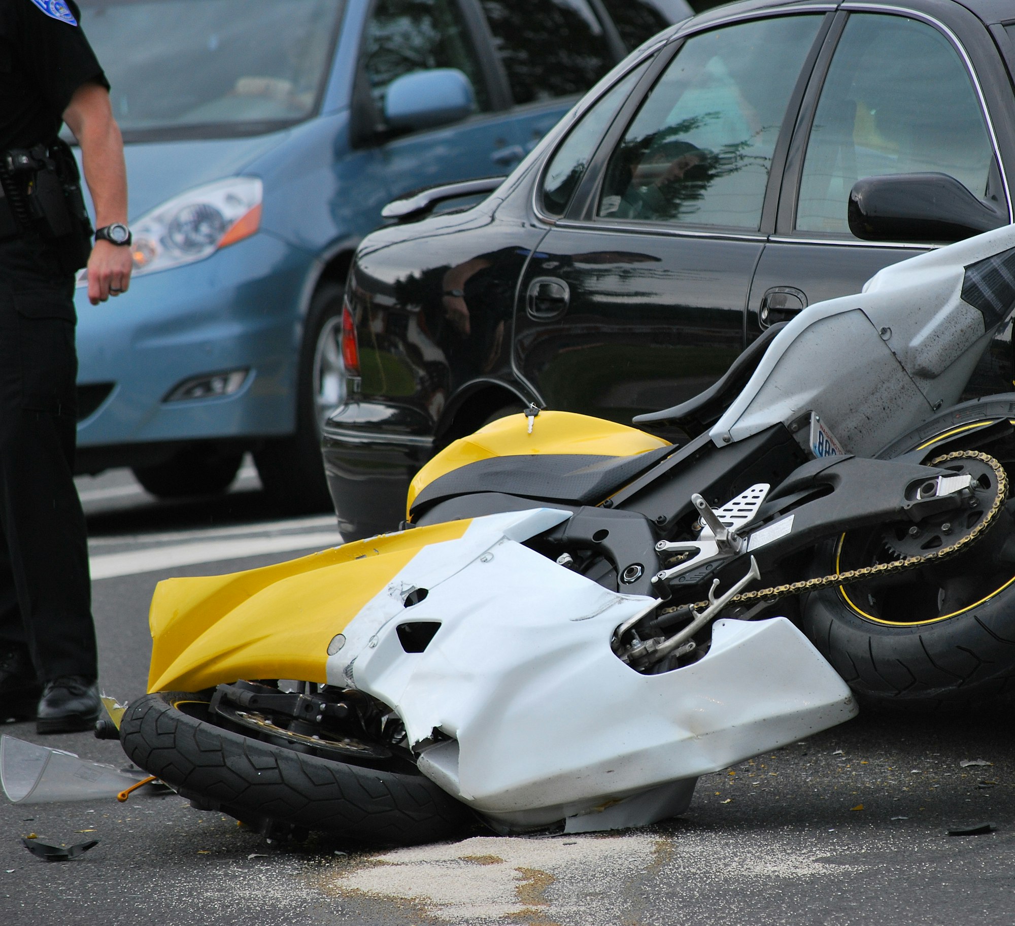 Yellow black motorcycle broken after an accident