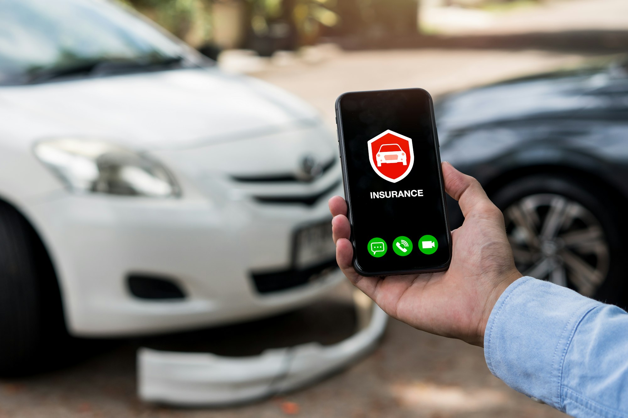 Car insurance concept.Man using phone to calling insurance agent for claim process after car crash.
