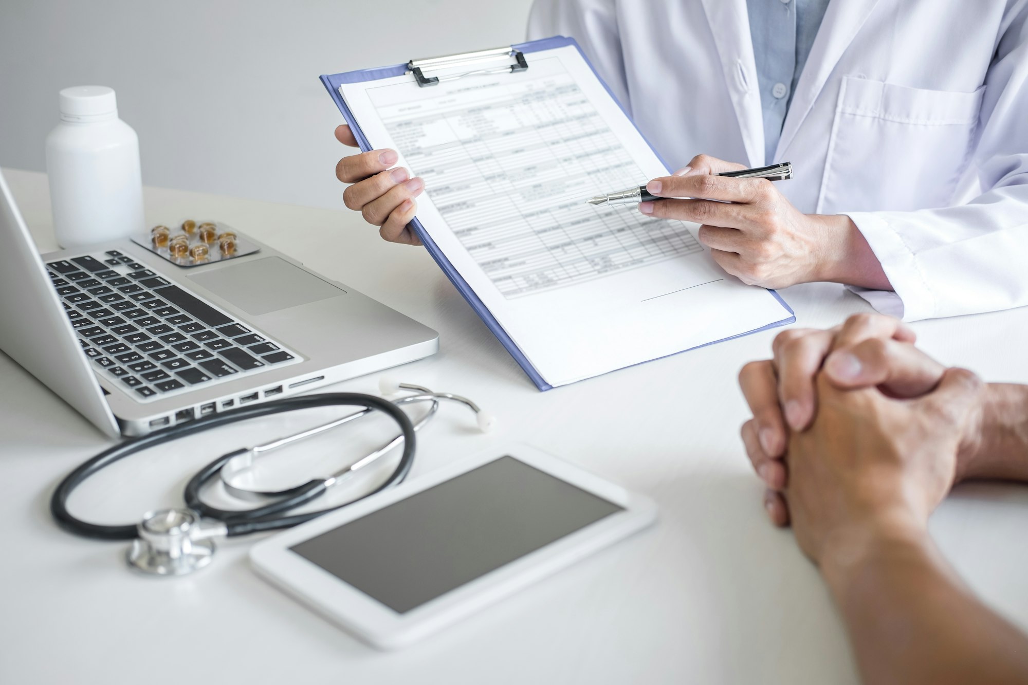 Doctor presenting report of diagnosis