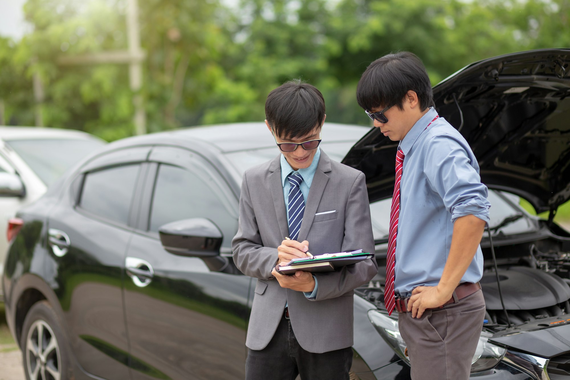 Insurance agent come to check the event to make a claim. Car insurance.