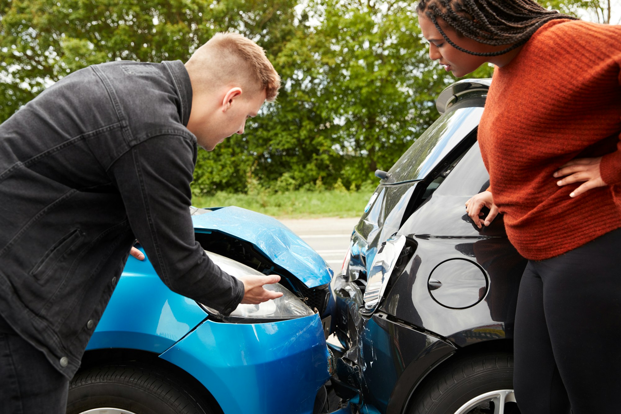 Two Angry Motorists Arguing Over Responsibility For Car Accident