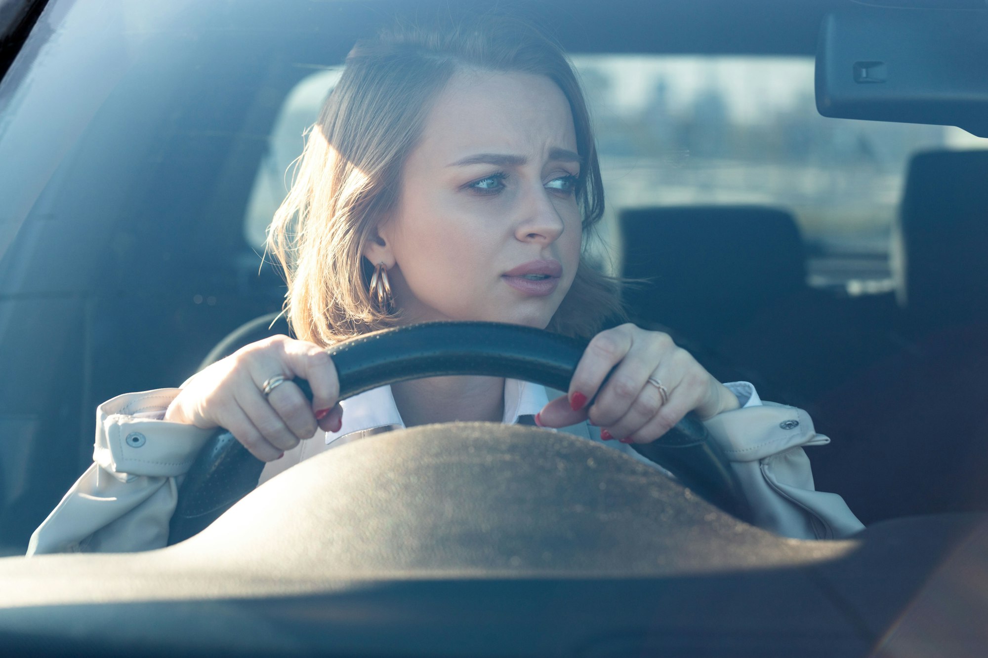 Female drives her car for the first time, tries to avoid a car accident, is very nervous and scared