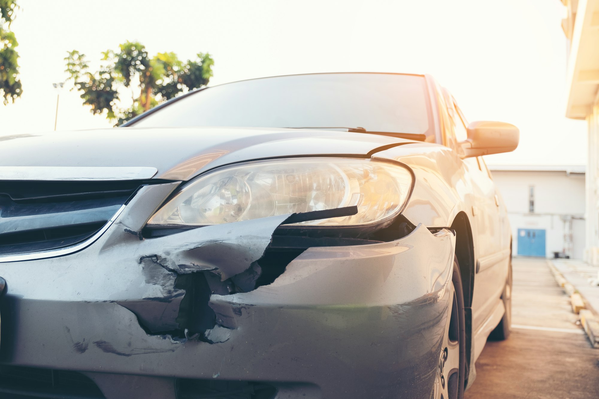Front side of accident car. Car crash accident damaged automobiles after collision in city