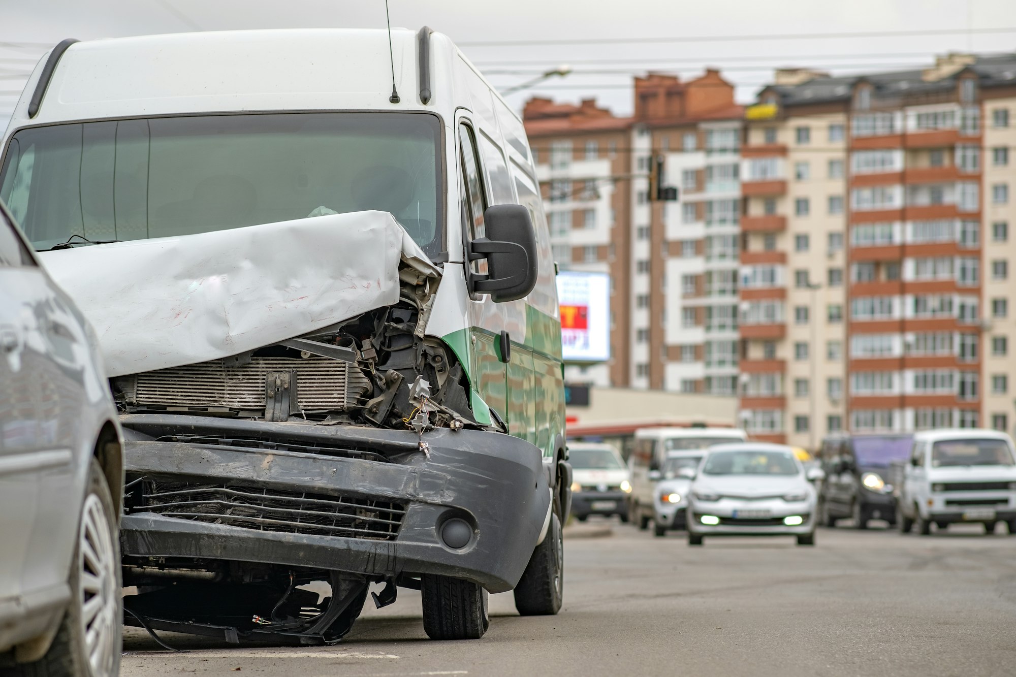 Heavily damaged car after car crash accident on a city street