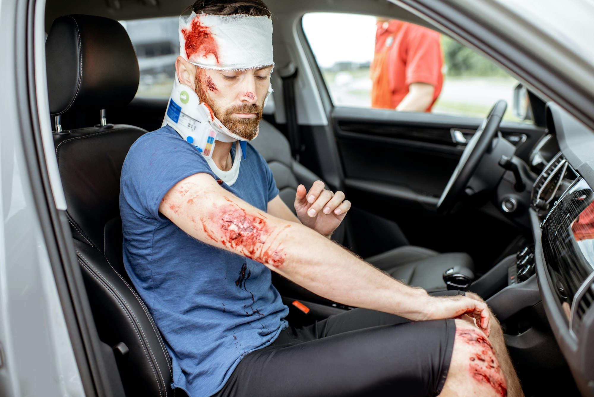 Injured man in the car after the road accident