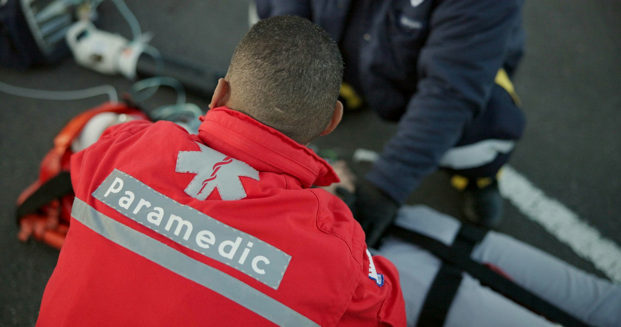 People, uniform and paramedics with emergency, healthcare and patient with injury, victim and servi