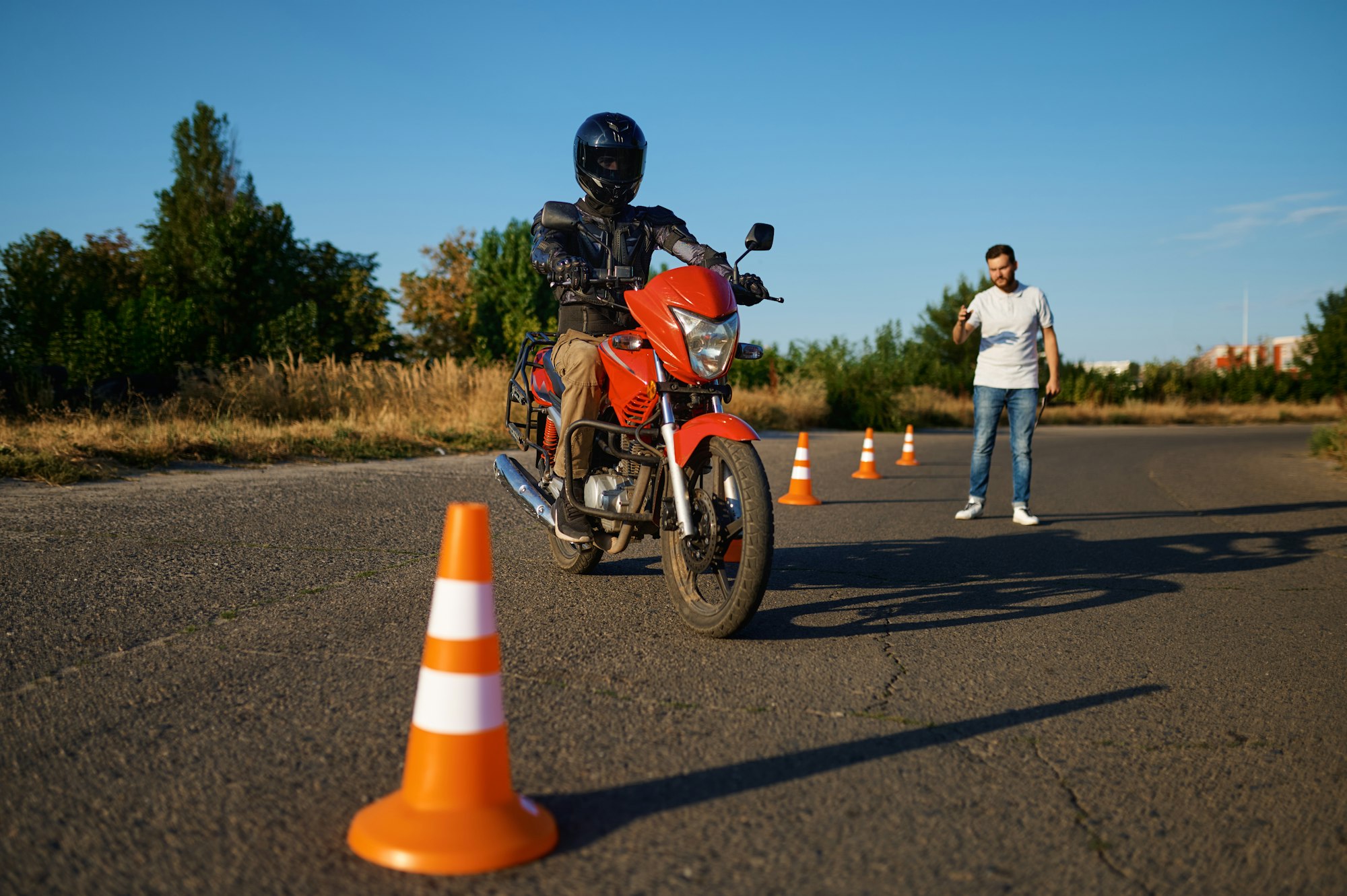 Student and instructor, exam in motorcycle school