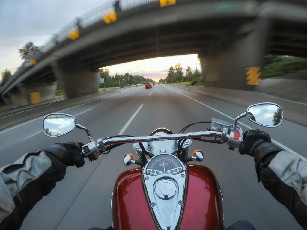 Riding a motorcycle during a vibrant sunset