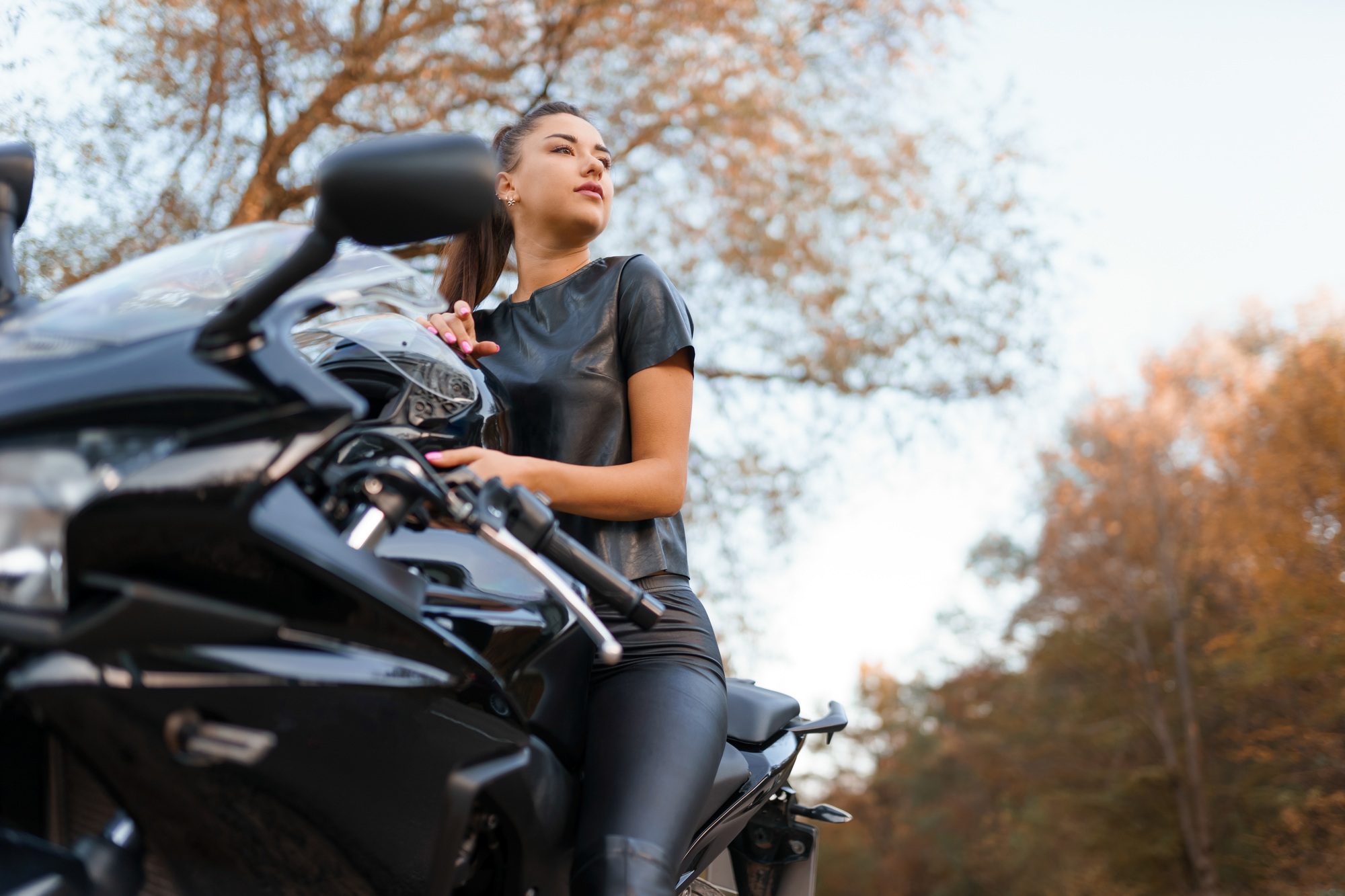 Beautiful girl on a sports motorcycle