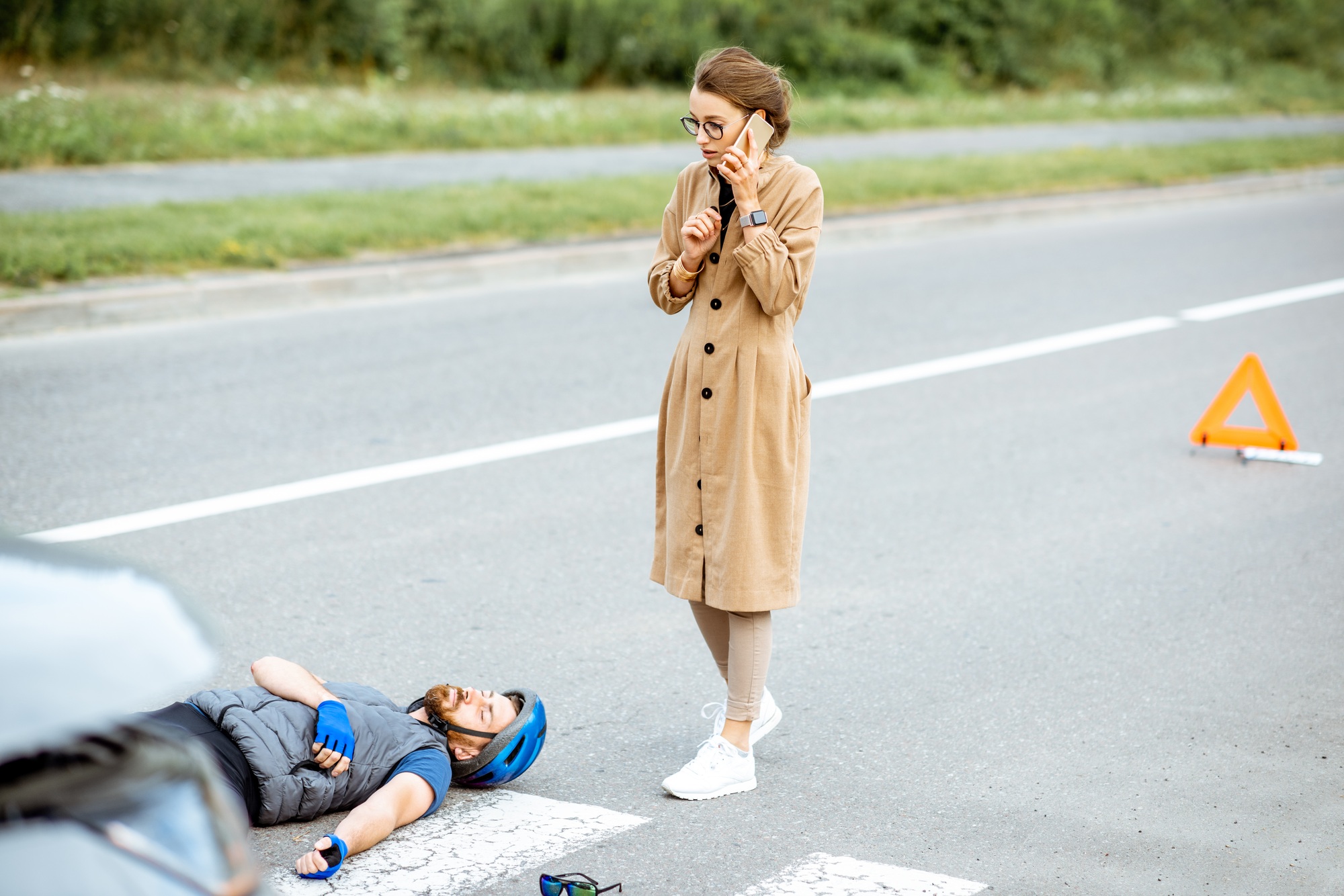 Road accident with injured cyclist and woman driver