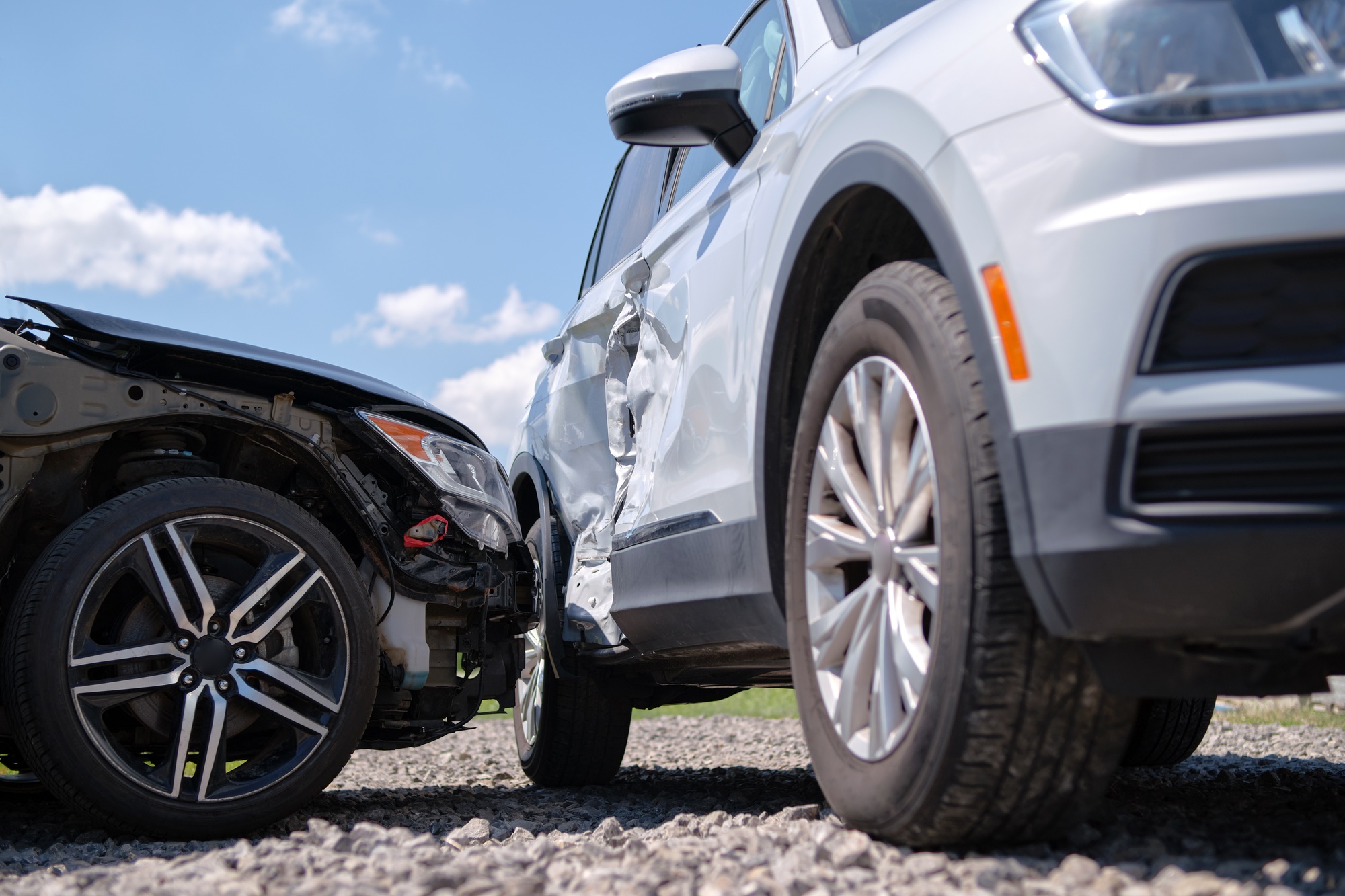 Cars crashed heavily in road accident after collision on city street.