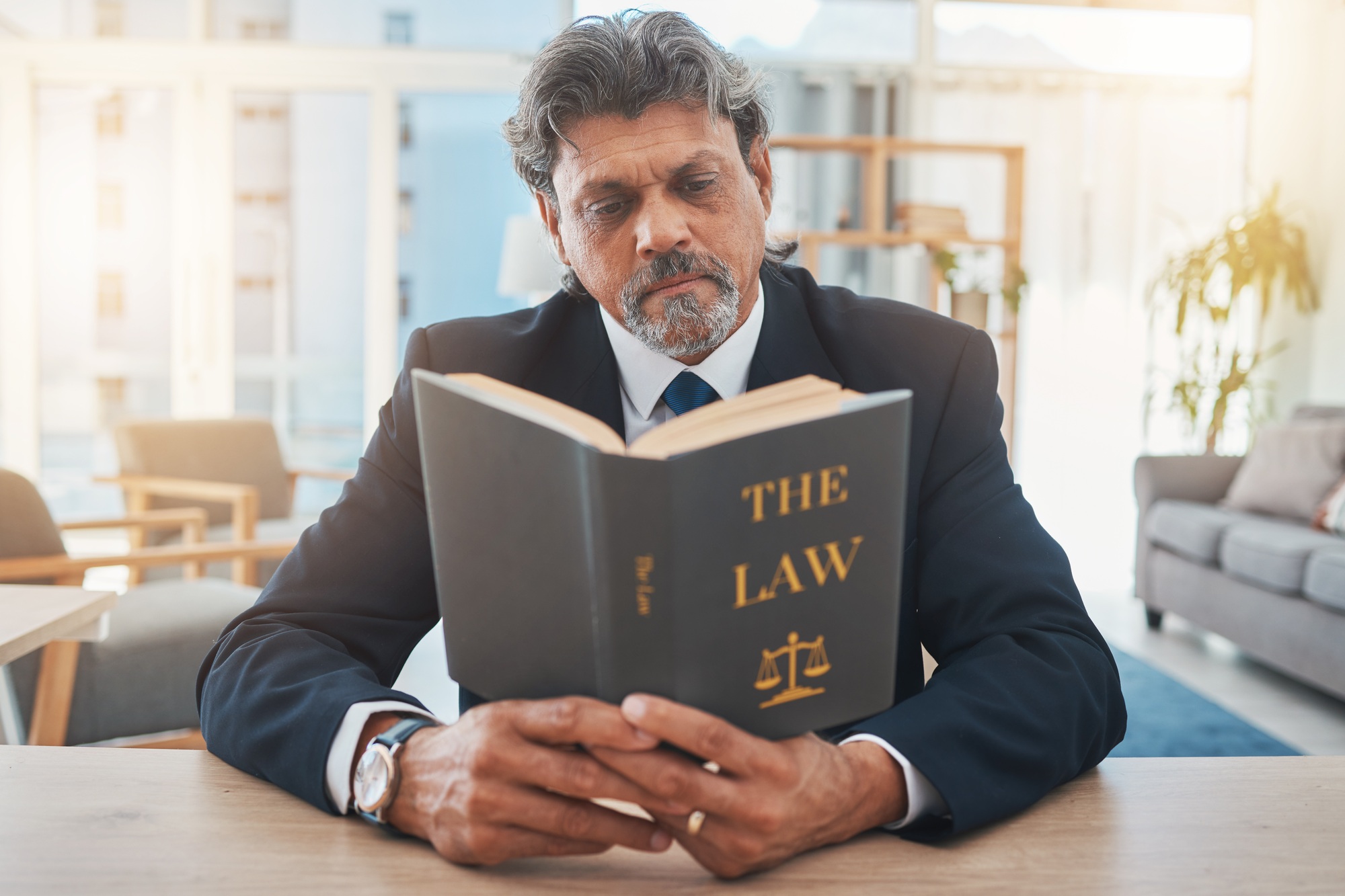 Lawyer, man and reading book in office for legal information, knowledge and business research, comp
