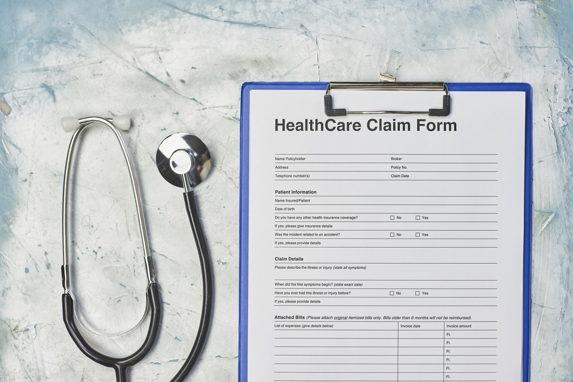 Healthcare claim form and a stethoscope