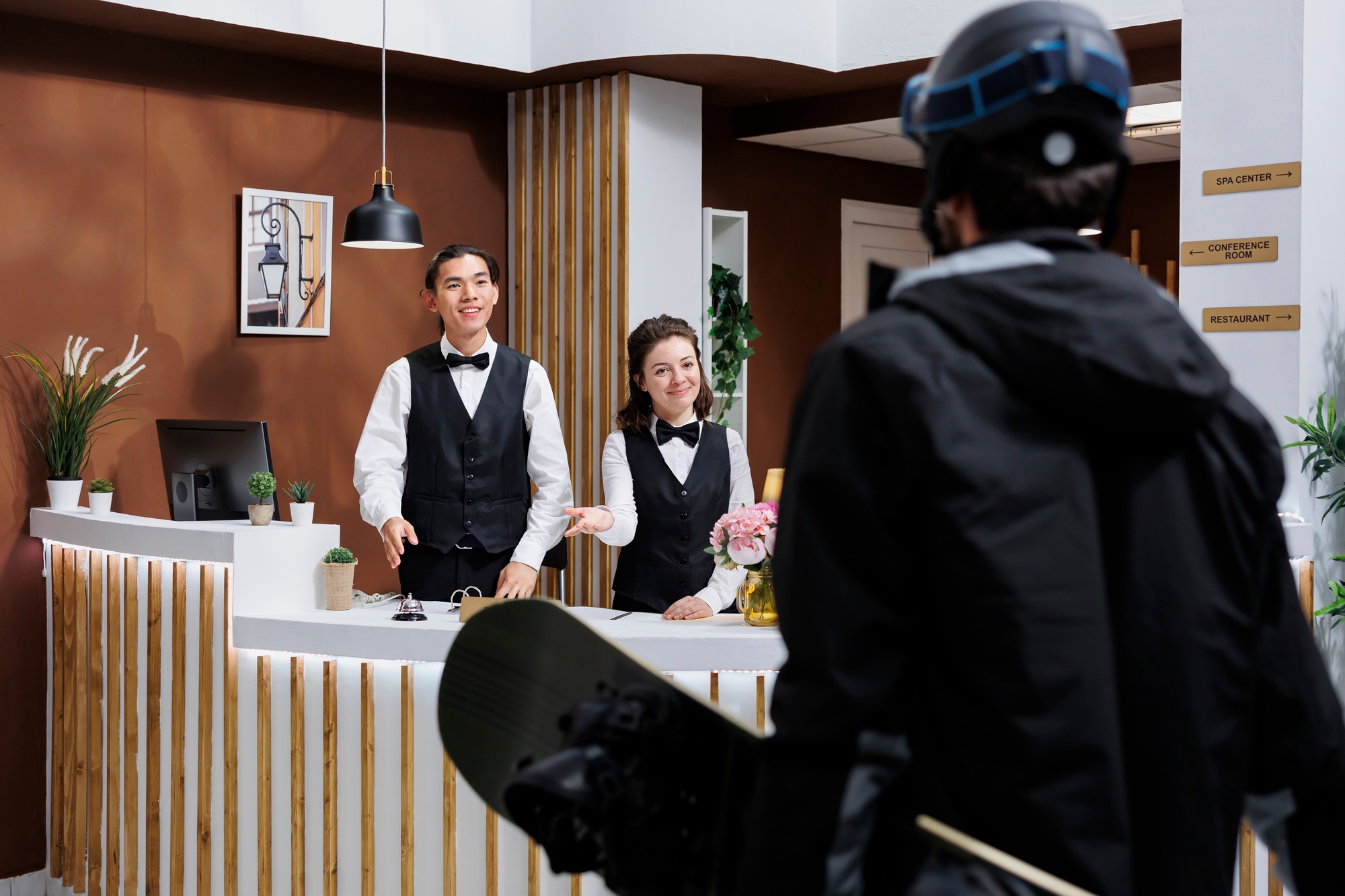 Receptionists welcoming guests at resort