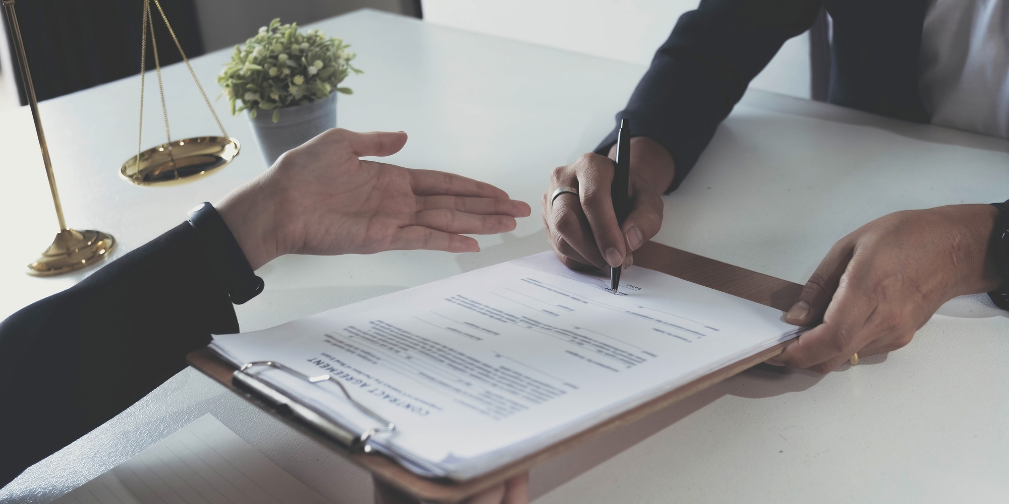 business people and lawyers discussing contract papers sitting at the table. Concepts of law, advice