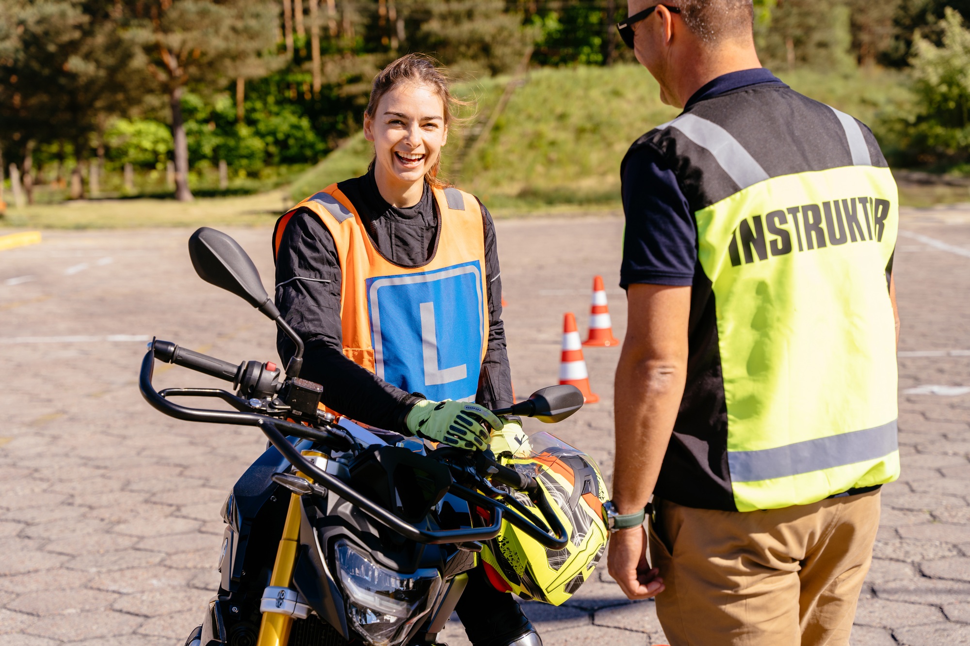female student. Learning to ride motorcycle concept.