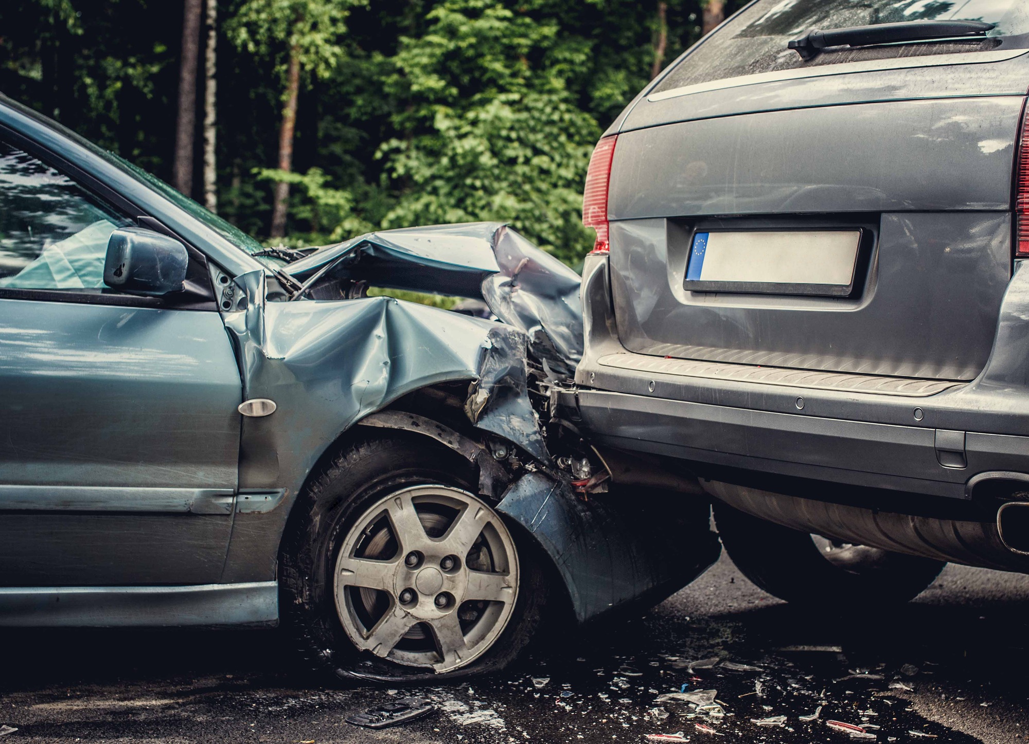 Close up smached cars on a road.