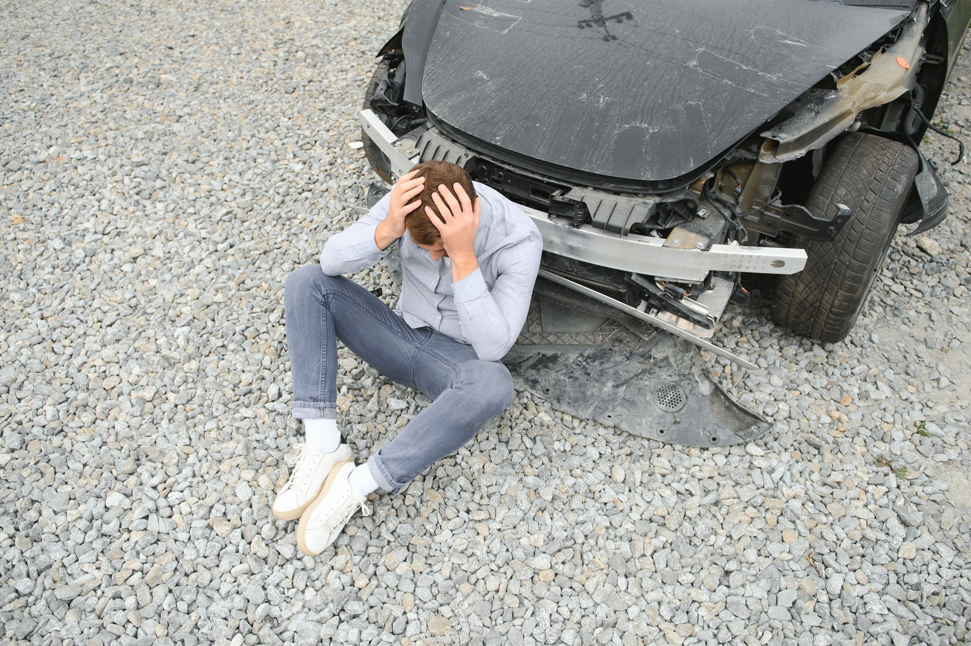 Car accident. Man after car accident. Man regrets damage caused during car wreck